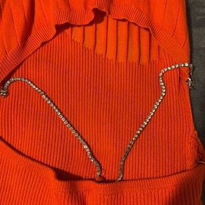 back out low cut draped acrossss each side a string of bling🥰